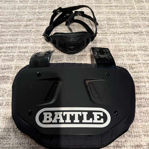Under Armour Chin guard and back protector.  Football - Picture 1 of 3